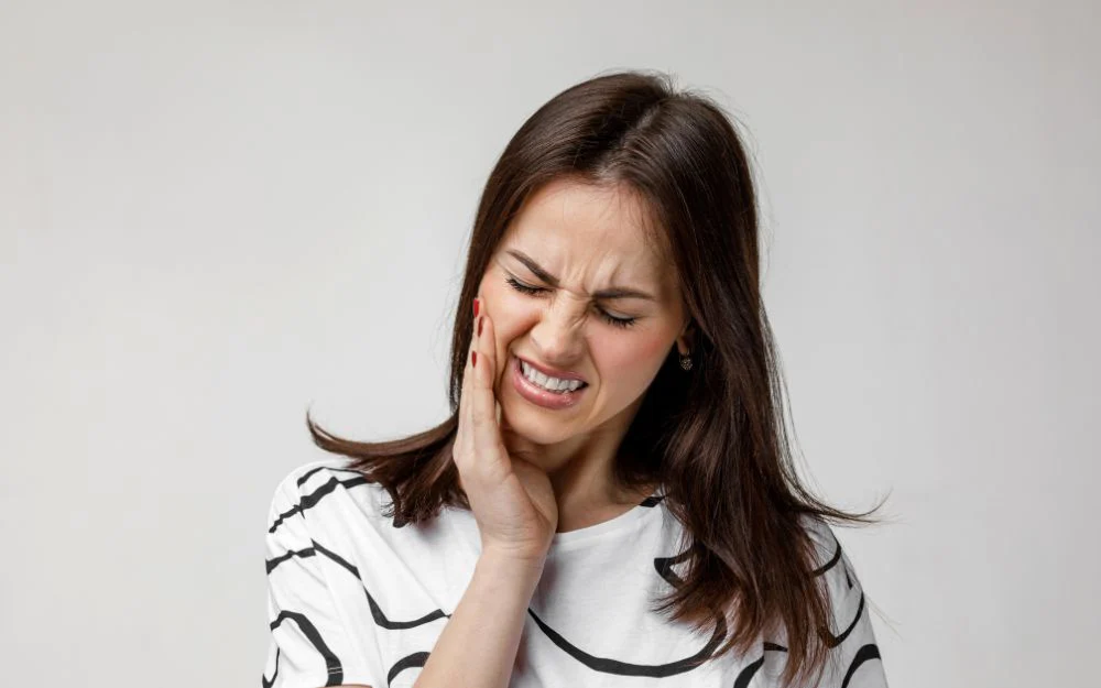 woman with pain from gum disease