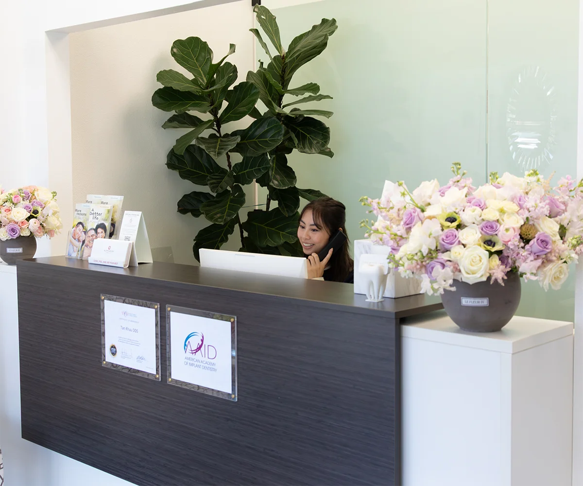 Tan Khuu DDS Front Desk Manager Answering A Phone Call